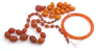 Mixed Lot: amber loose beads and an amber bangle, g/w 68.2gms