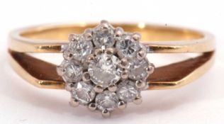 Diamond cluster ring, a flowerhead design, featuring nine round brilliant cut diamonds, 0.50ct