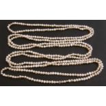 Long string of Honora cultured freshwater pearls, length 4ft 5ins long in original box and