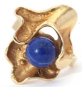 Designer ring featuring a round lapis lazuli bead in a stylised polished and burnished mount,