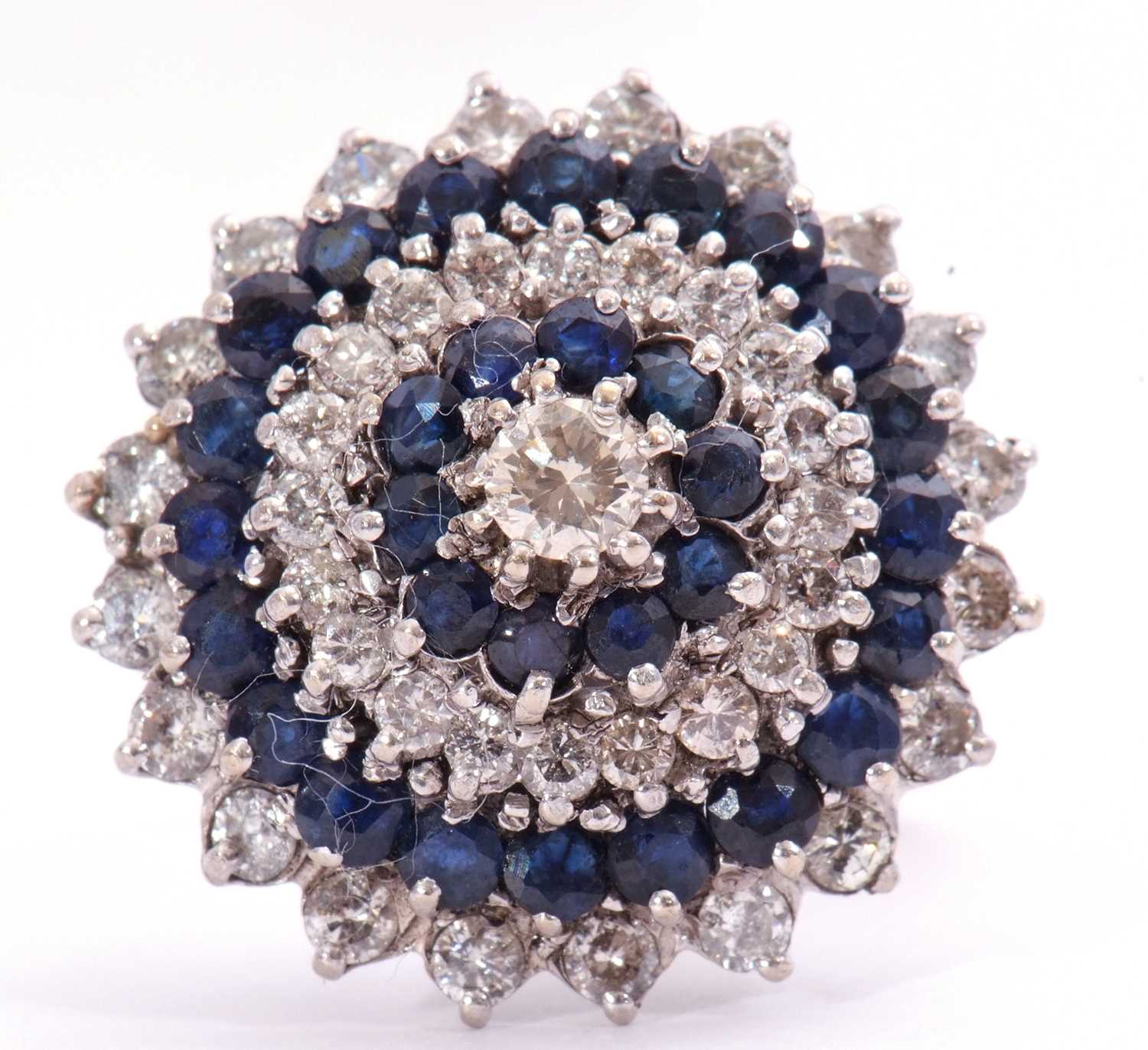 Large diamond and sapphire cocktail ring of dome design, centring a brilliant cut diamond, 0.20ct - Image 2 of 7