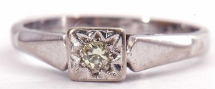Precious metal single stone diamond ring featuring a round brilliant cut diamond in an engraved star