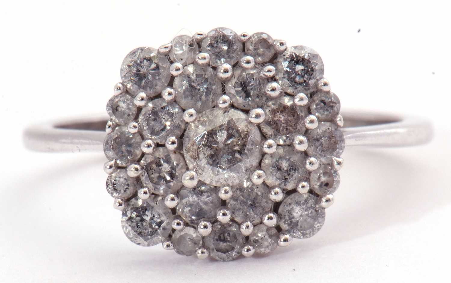 Modern small diamond cluster ring, the panel set with three tiers of small mixed cut diamonds, the