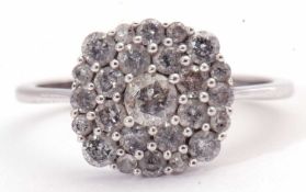 Modern small diamond cluster ring, the panel set with three tiers of small mixed cut diamonds, the