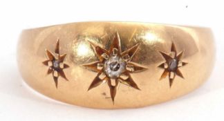 Antique 18ct gold and diamond ring featuring three small diamonds, each in a star engraved