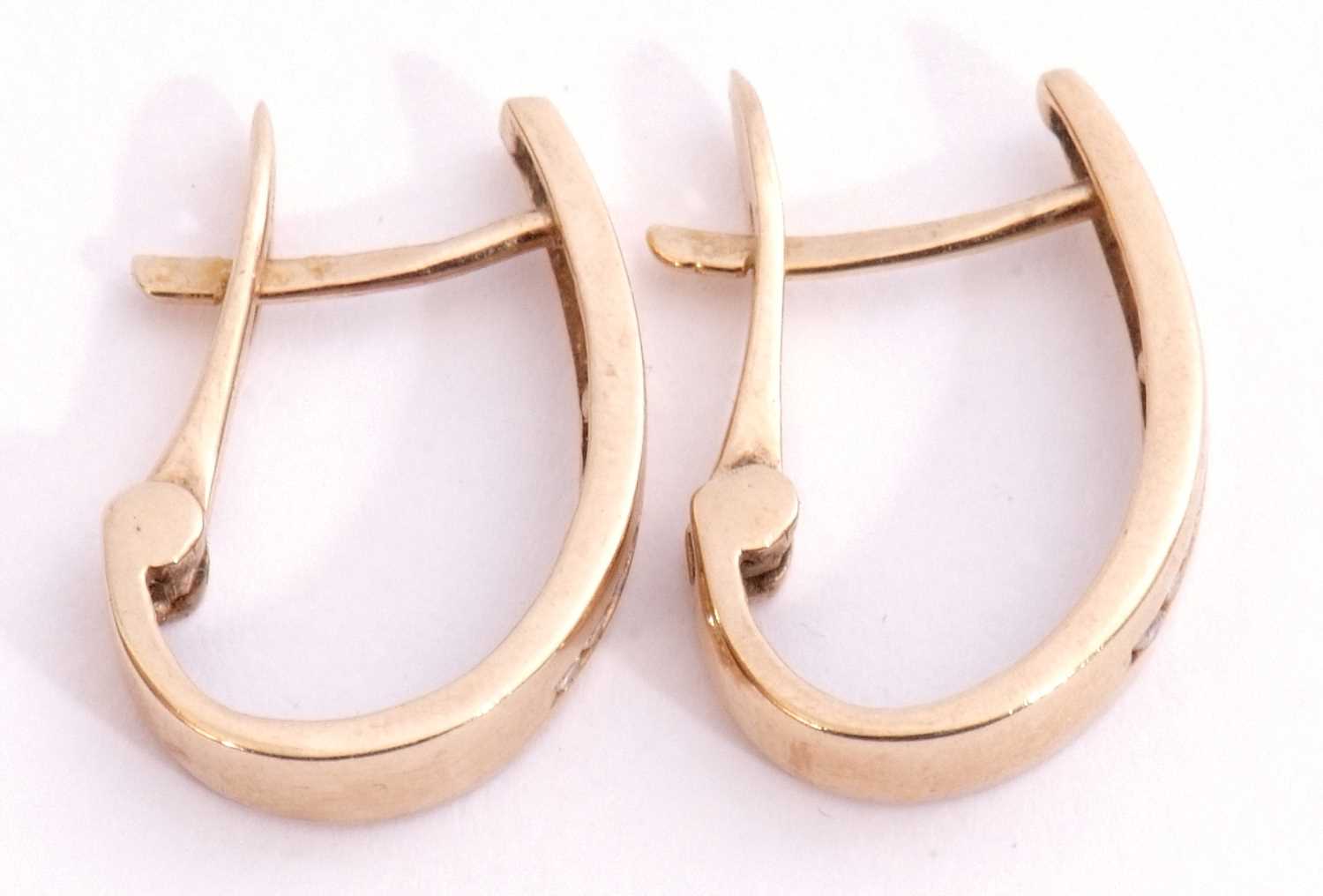 Pair of 10k stamped diamond set hoop earrings, a plain polished design, each channel set with 9 - Image 2 of 5