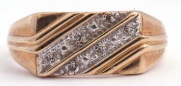 Gents 9ct gold and diamond set ring, the panel a rectangular angular shaped design decorated with