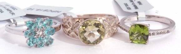 Mixed Lot: lemon quartz dress ring, a peridot and white topaz ring, together with an apatite and