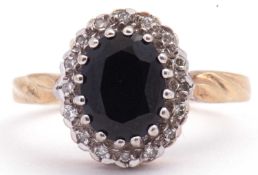 9ct gold sapphire and diamond cluster ring, the oval dark blue sapphire multi-claw set within a