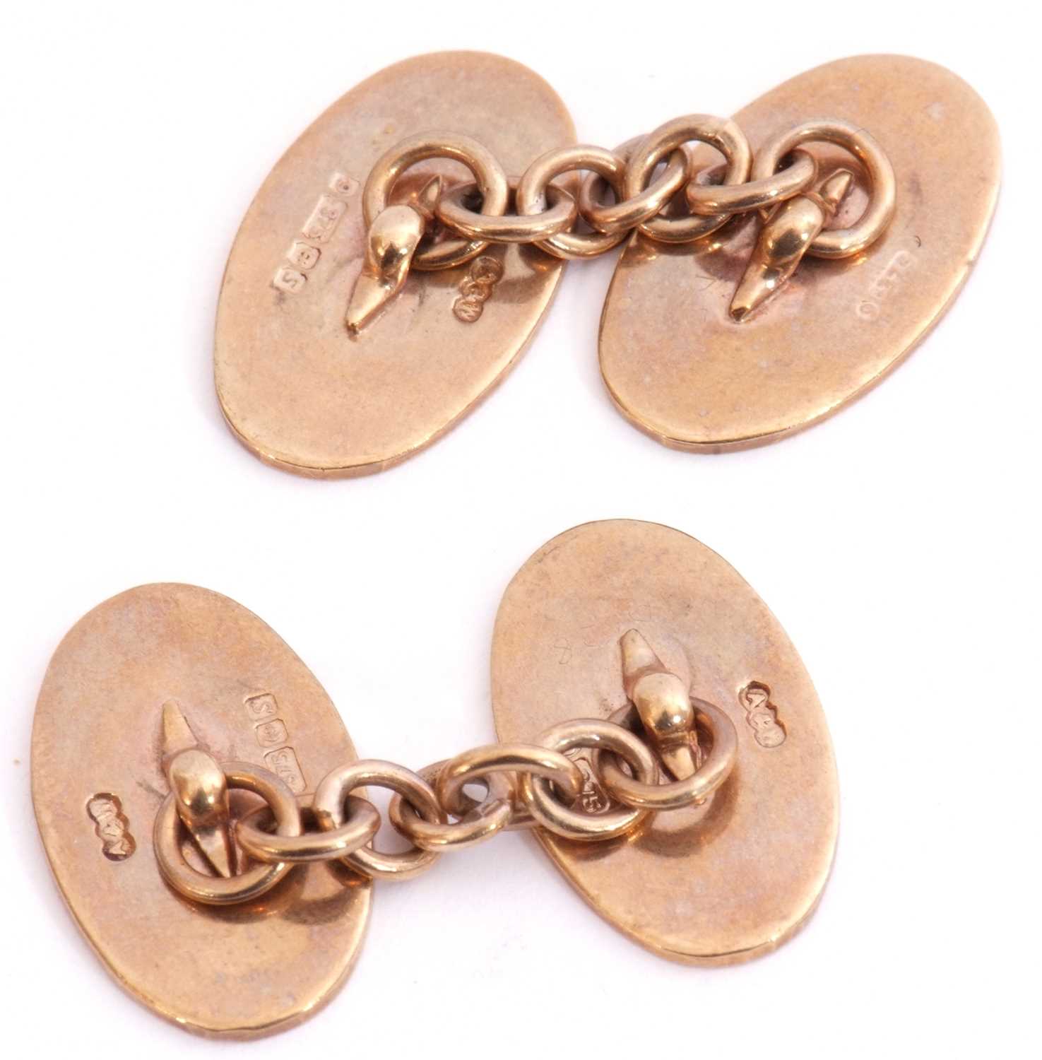 Pair of 9ct gold cuff links of oval shape, each panel with engine turned decoration, chain - Image 2 of 2