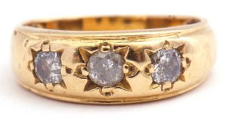 Three stone diamond ring featuring three round cut diamonds, each in engraved settings, ct wt