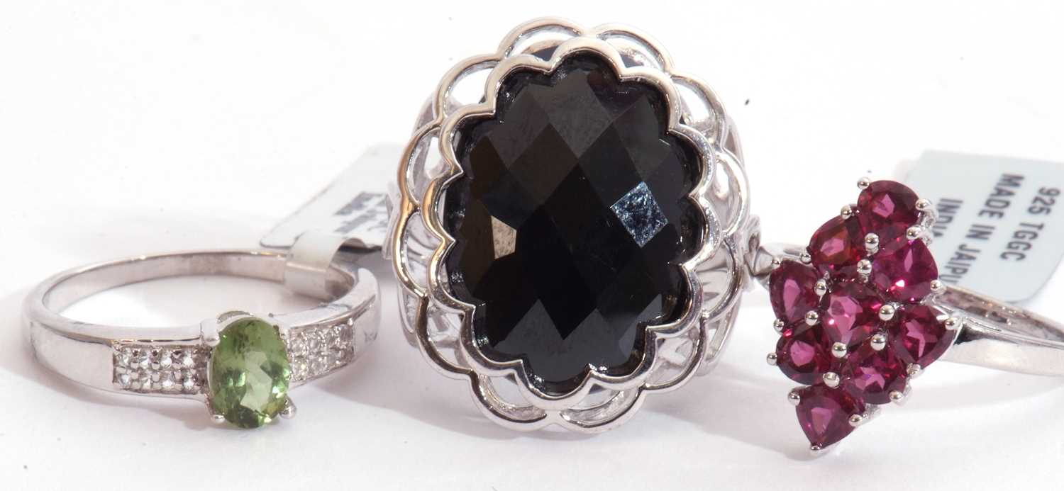 Mixed Lot: black spinel faceted dress ring, a Rajasthan garnet cluster ring, together with an