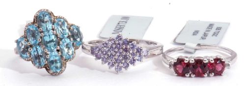 Mixed Lot: modern tanzanite lozenge shaped cluster ring, a Swiss blue topaz cluster ring, together