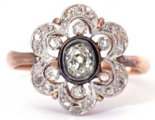 Antique diamond cluster ring, the centre old cut diamond bezel set in an open work design, further