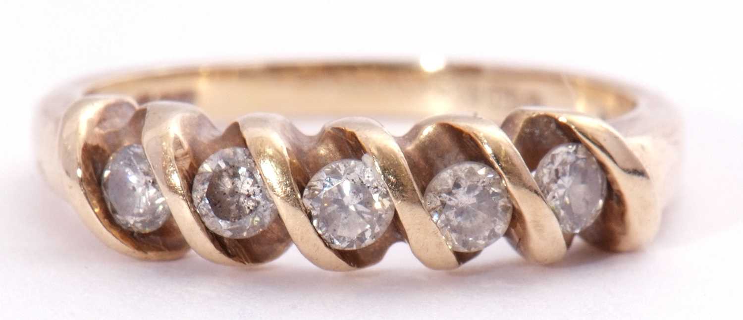 Modern 9ct gold five stone diamond ring featuring five small round cut diamonds between an S-bar