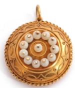 Antique gold Etruscan style locket pendant of circular shape decorated with small beads in typical