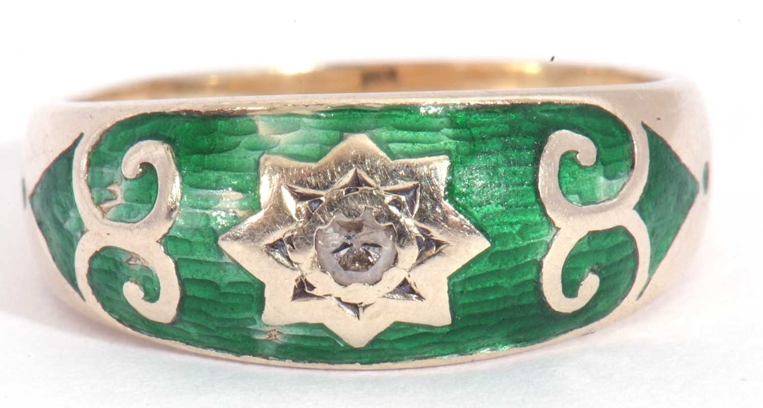9ct gold green enamel and diamond ring centring a small diamond in a star engraved setting, within a