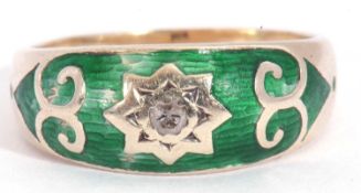 9ct gold green enamel and diamond ring centring a small diamond in a star engraved setting, within a