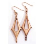 Pair of yellow metal Etruscan style large drop earrings of plain pierced angular design with