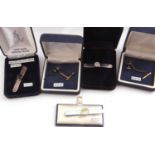 Mixed Lot: three white metal tie clips and two gilt metal tie pins (5)