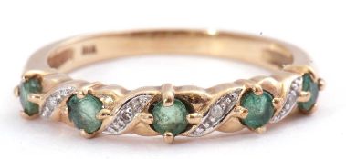 Modern diamond and emerald half eternity ring, alternate set with five round faceted small emeralds,