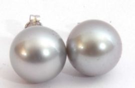 Pair of Tahitian pearl earrings, 11.14mm diam, both post fittings, butterflies stamped 750