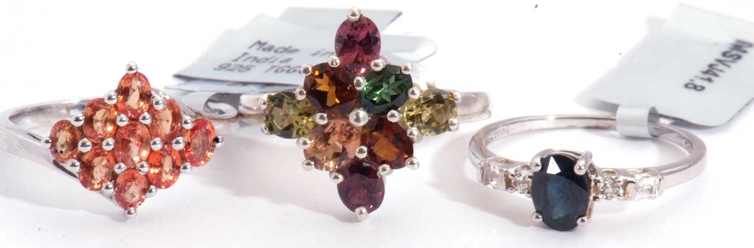 Mixed Lot: blue sapphire and white topaz five stone ring, a multi-coloured tourmaline cluster ring