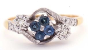 18ct gold sapphire and diamond cross over ring, the centre with a cluster of four round sapphires