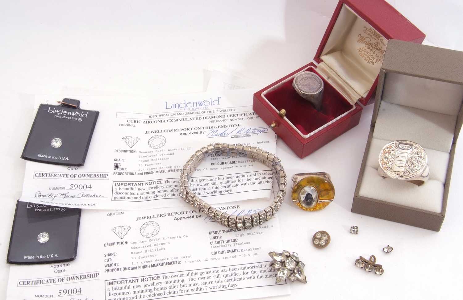 Mixed Lot: two certificated cubic zirconia stones, two large dress rings, one marked 'Dior', a - Image 2 of 4