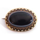 Victorian gold agate and enamel mourning brooch, the large oval shaped banded agate 26 x 12mm raised