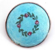 Antique silver and enamel brooch of circular shape, a light blue guilloche enamel ground decorated