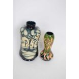 Two Moorcroft trial vases, one with tube lined stylised trees in a landscape, marked 'trial 23805'