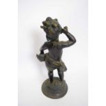 Bronze model of a cherub on raised base, 38cm high