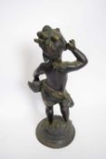 Bronze model of a cherub on raised base, 38cm high