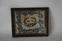 19th century beadwork embroidery decorated with garlands of blue flowers and pearls, signed to