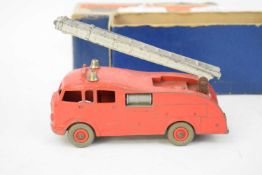 Dinky die-cast toy fire engine, No 555, in original box (play worn condition)