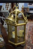 Hexagonal brass and glass mounted lantern light fitting with three internal electric lights, 48cm