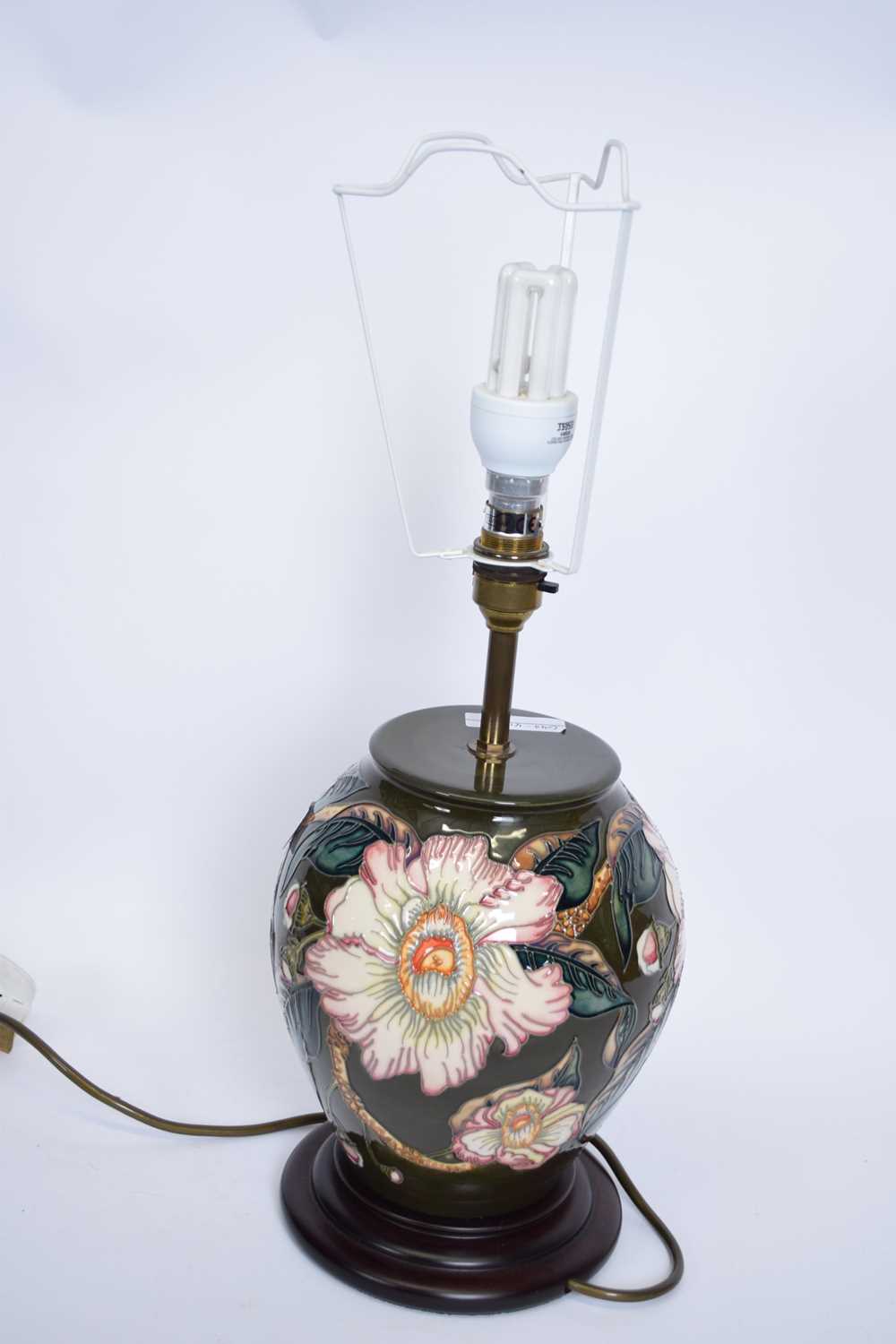 Moorcroft table lamp with tube lined floral design with beige shade