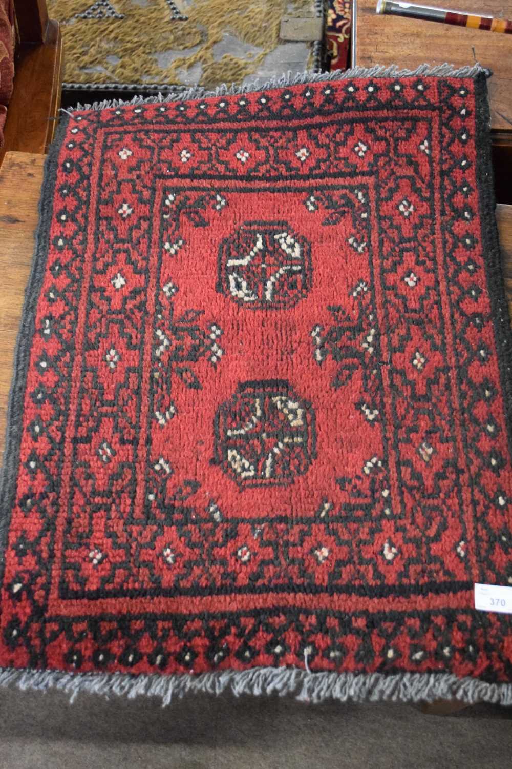 Small Bokhara type wool prayer mat decorated with two lozenges on a red background, together with - Image 2 of 2