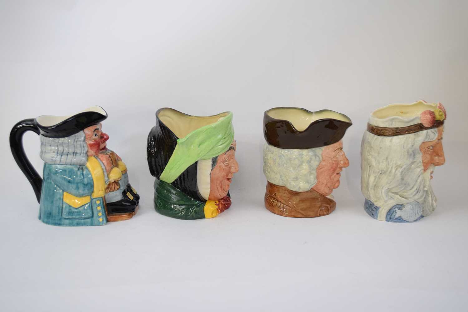 Group of character jugs, Royal Doulton Sari Gamp, Sam Johnson, Neptune and a Clarice Cliff