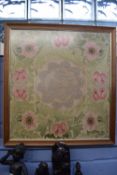 Two framed needlework pictures, one with a lace work centre surrounded by pink flowers and