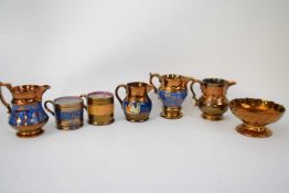 Quantity of lustre ware jugs and two small cans (7)