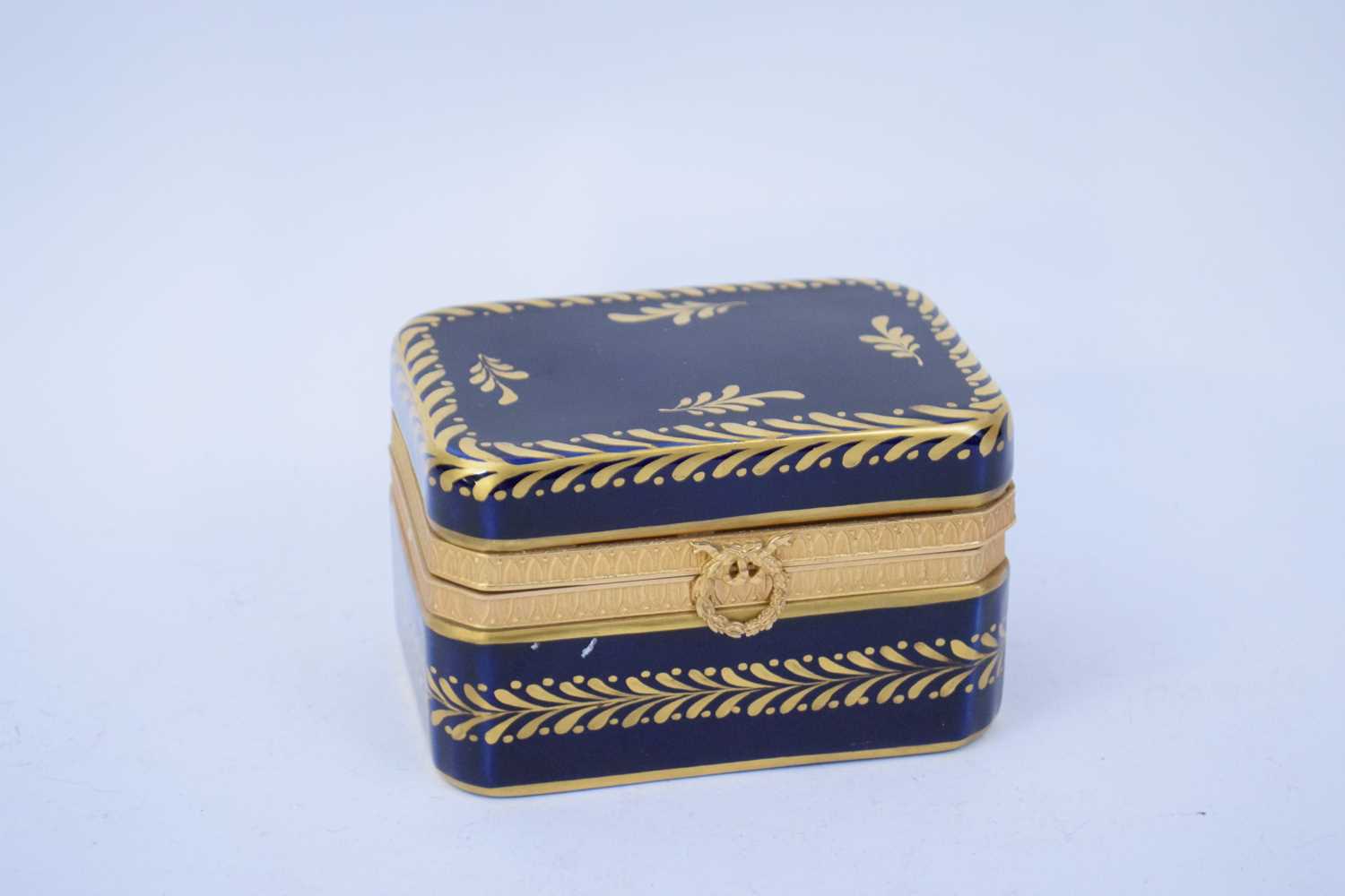 Sevres style ceramic box, the blue ground with gilt design