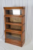 Globe Wenicke, a four tier oak stacking bookcase, 159cm high