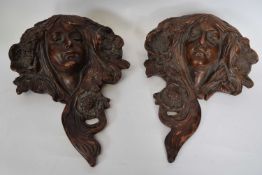 Pair of pottery wall pockets, both modelled in Art Nouveau style as maidens, 40cm long (2)