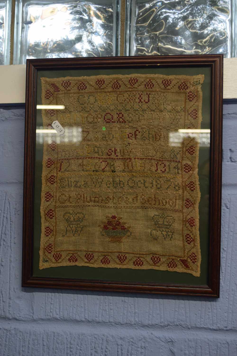 19th century needlework sampler decorated with rows of numbres and letters, signed 'Liza Webb,