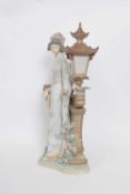 Large Lladro figure of a Japanese lady with fan standing against a lantern on shaped base, 40cm