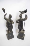 Pair of spelter figures of Continental soldiers raised on plinths, 42cm high (2)