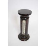 Mercury thermometer set into an onyx pedestal, 21cm high