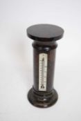 Mercury thermometer set into an onyx pedestal, 21cm high